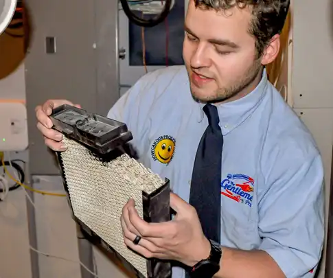 Humidifier on furnace, replacing humidifier filter on furnace, build up on furnace humidifier in Calgary, Edmonton or Red Deer Alberta